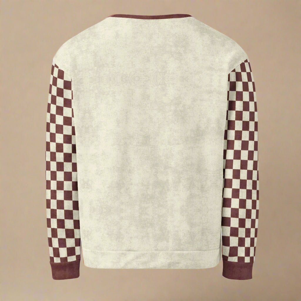 Sweater with checkered sleeves on a beige background