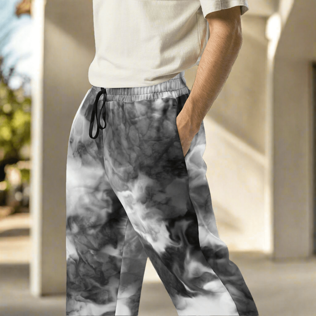 Person wearing gray tie-dye pants with a blurred background