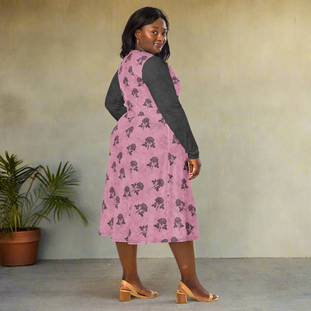 Woman wearing a pink floral dress with a plain background