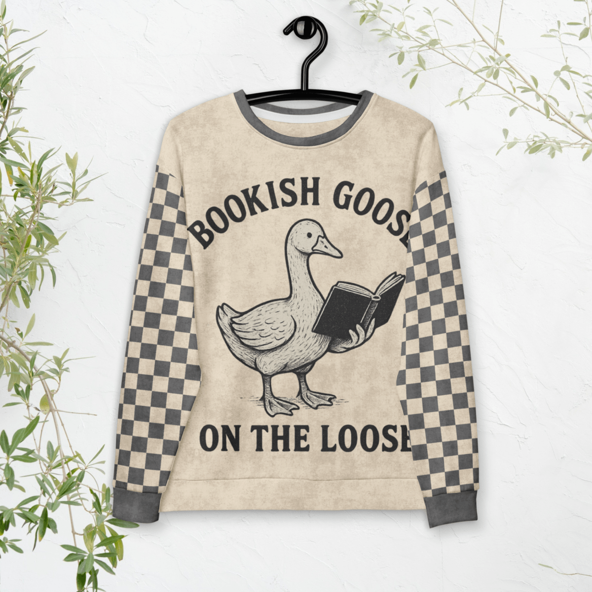 Sweatshirt with a goose holding a book design and text 'Bookish Goose on the Loose' on a hanger.
