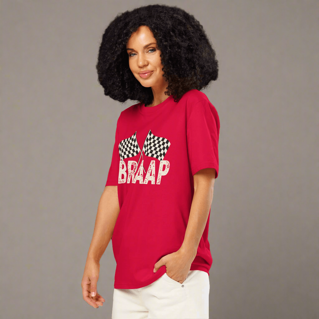 Woman wearing a red t-shirt with 'BRAAP' and checkered flags design on a neutral background