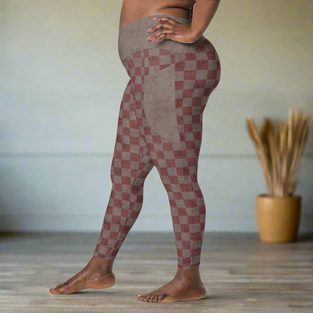 Person wearing checkered leggings with a neutral background
