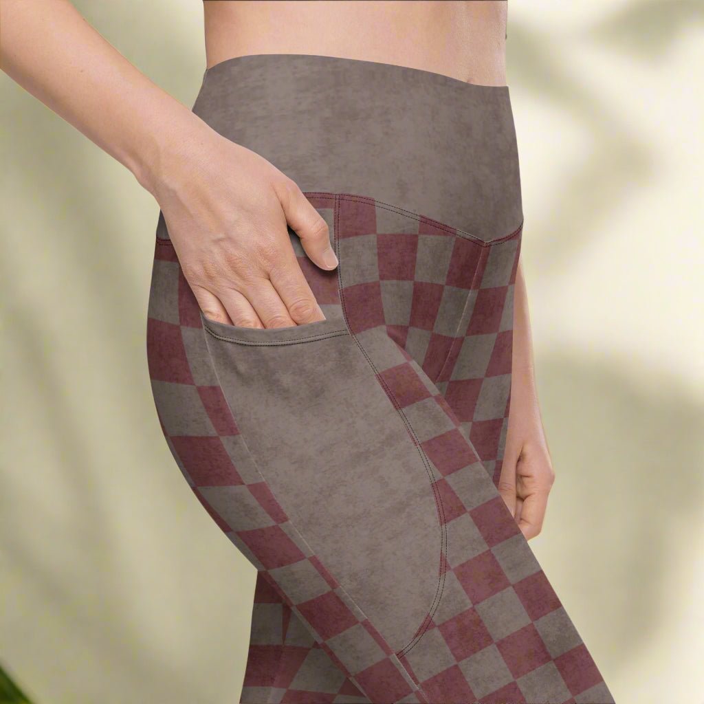 Checkered pants with a pattern of brown and burgundy on a neutral background