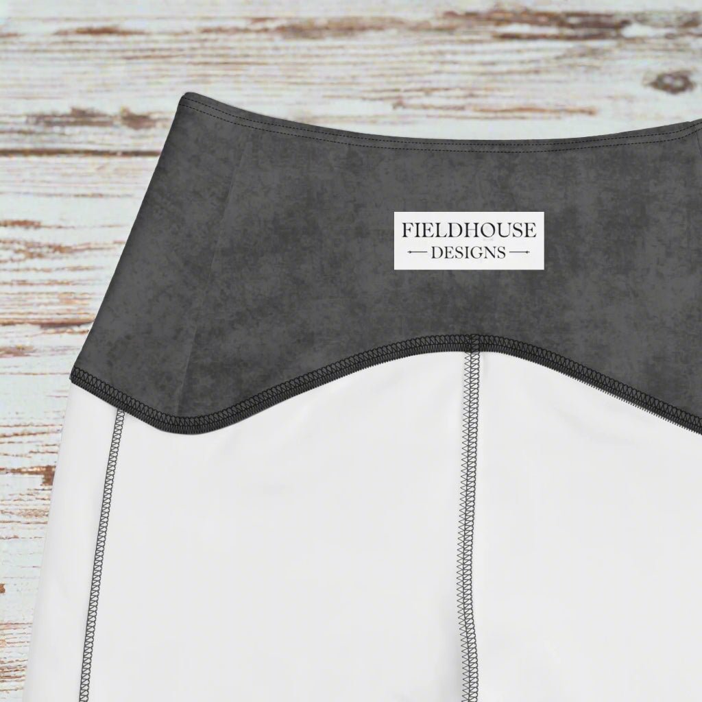 Close-up of a gray waistband with 'Fieldhouse Designs' label on a white background