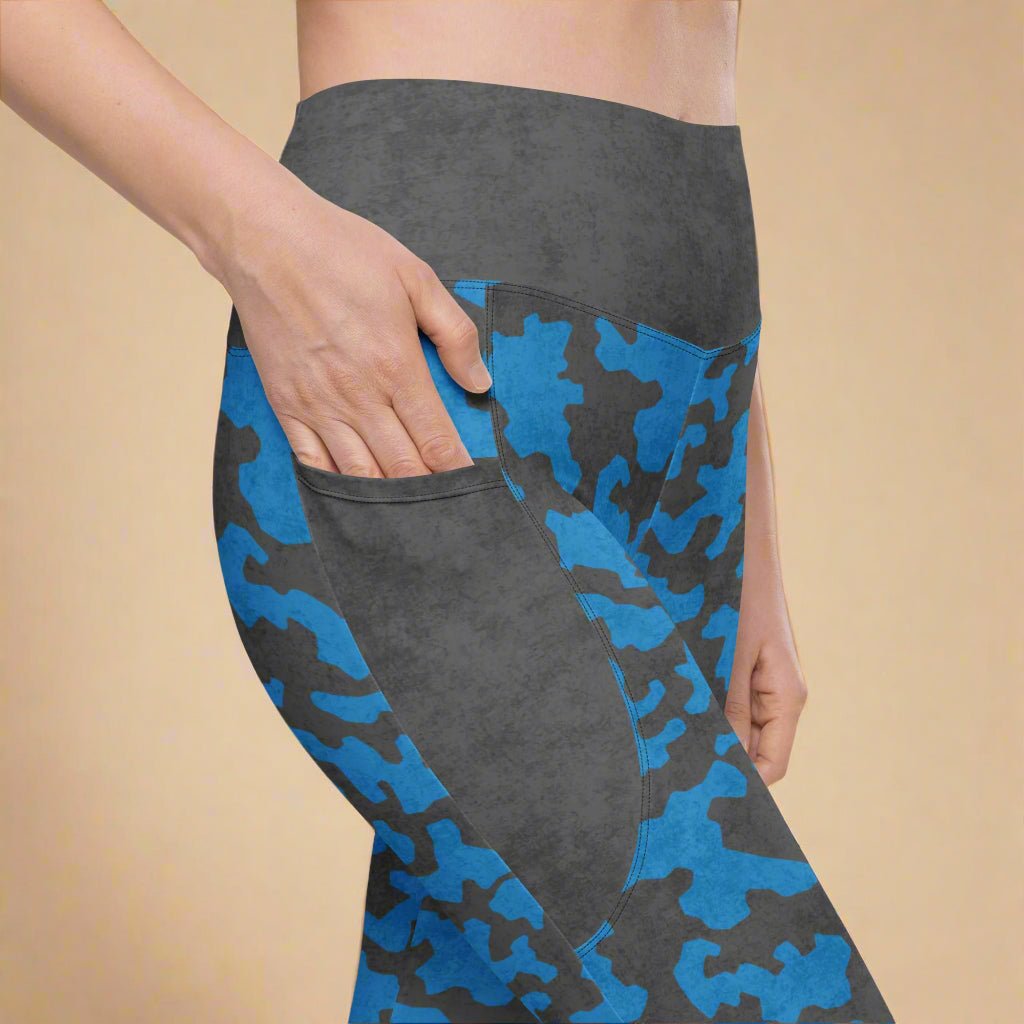 Gray and blue camouflage leggings with a beige background