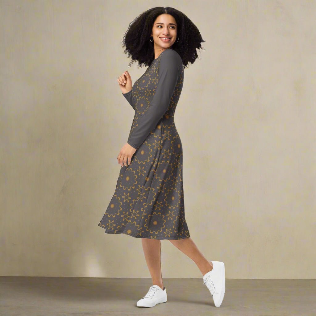 Woman wearing a patterned dress with white sneakers on a beige background