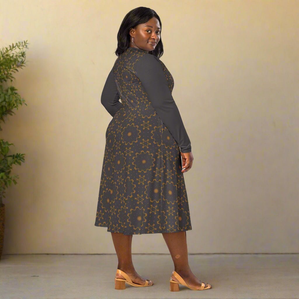 Woman wearing a patterned dress with a plain background