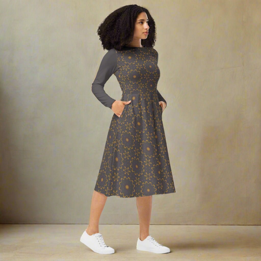 Woman wearing a patterned dress with a plain background