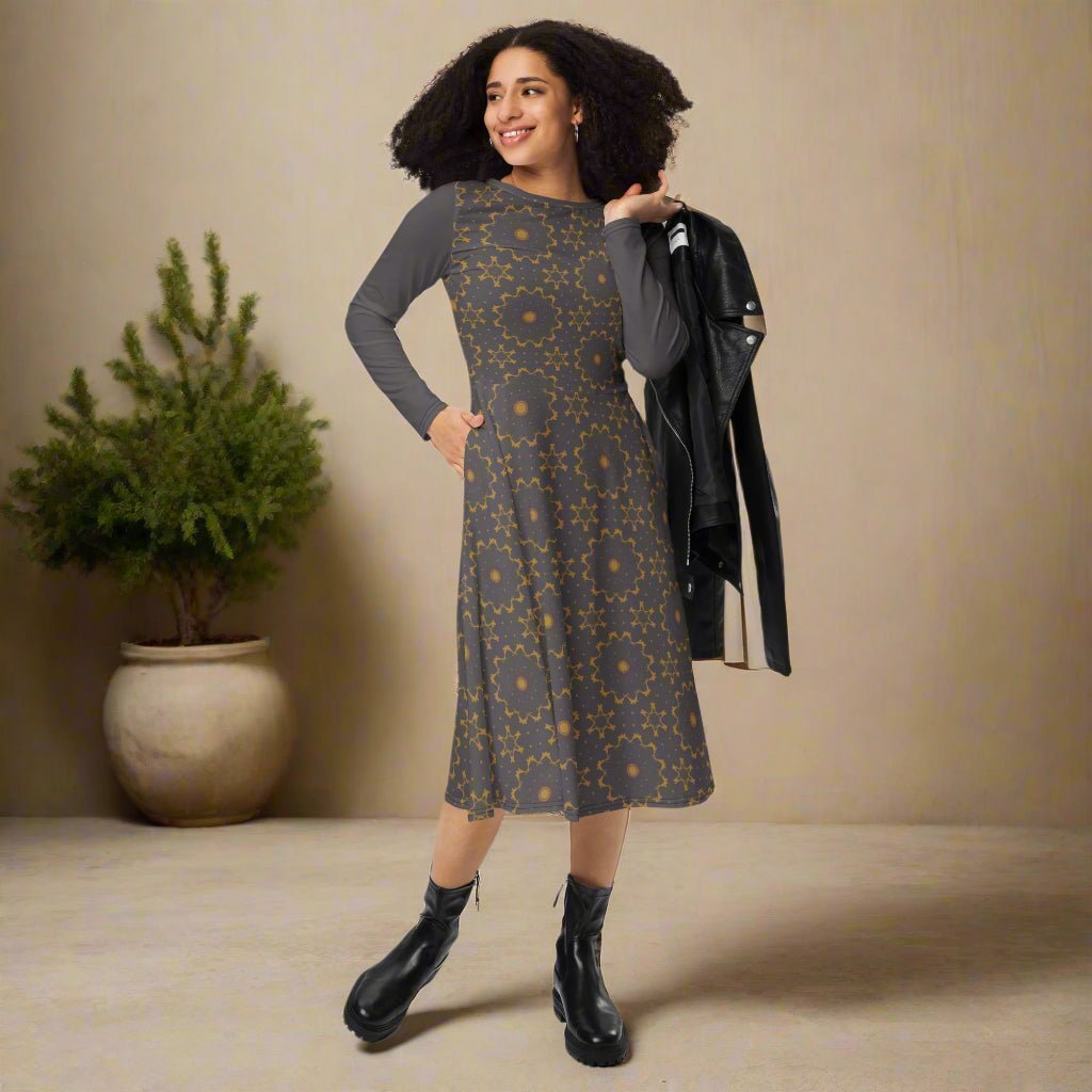Woman wearing a patterned dress with a neutral background
