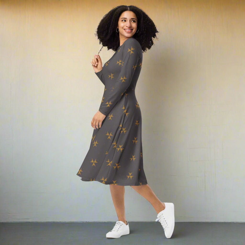 Woman wearing a gray dress with star patterns and white sneakers on a gradient background