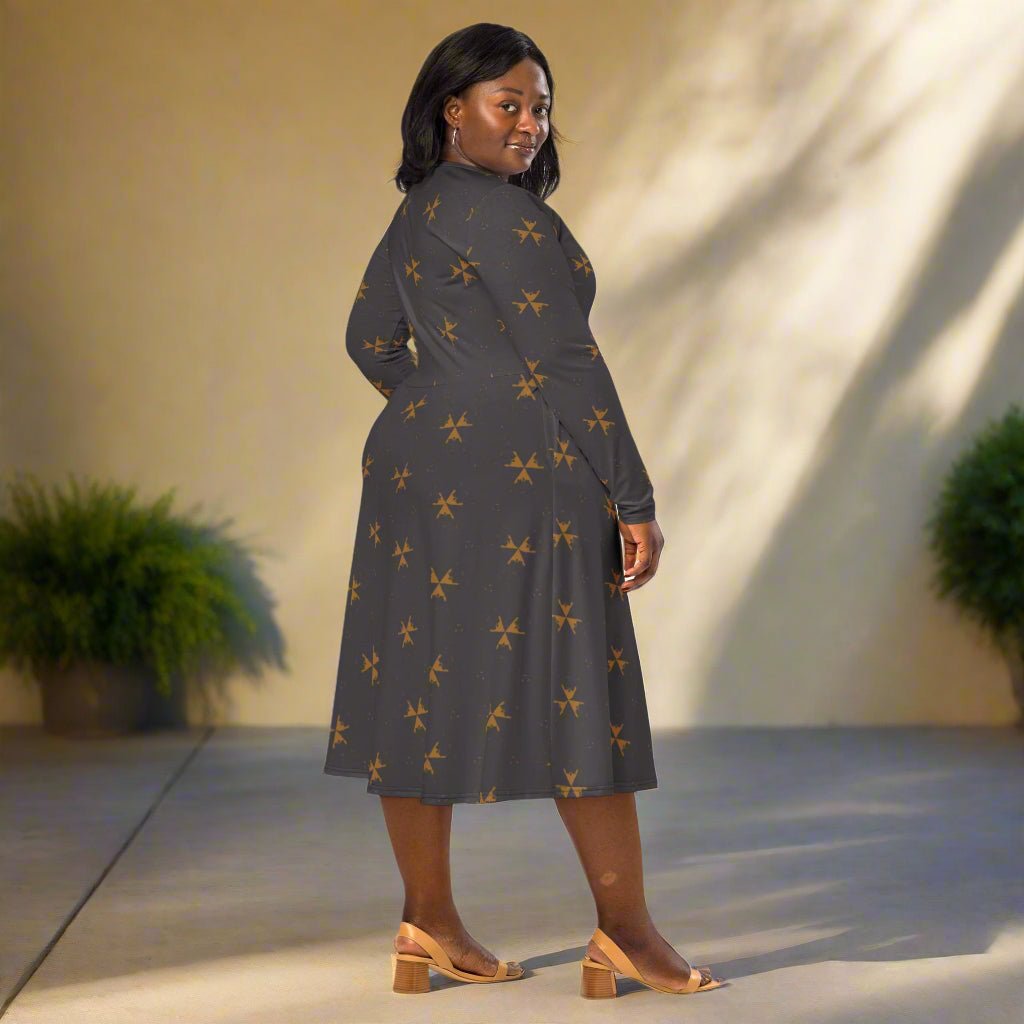 Woman wearing a dark dress with a subtle pattern in an outdoor setting