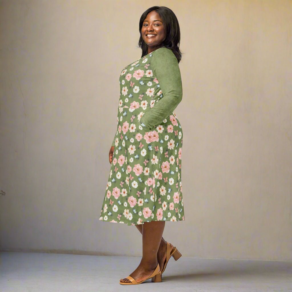 Woman wearing a green floral dress on a beige background