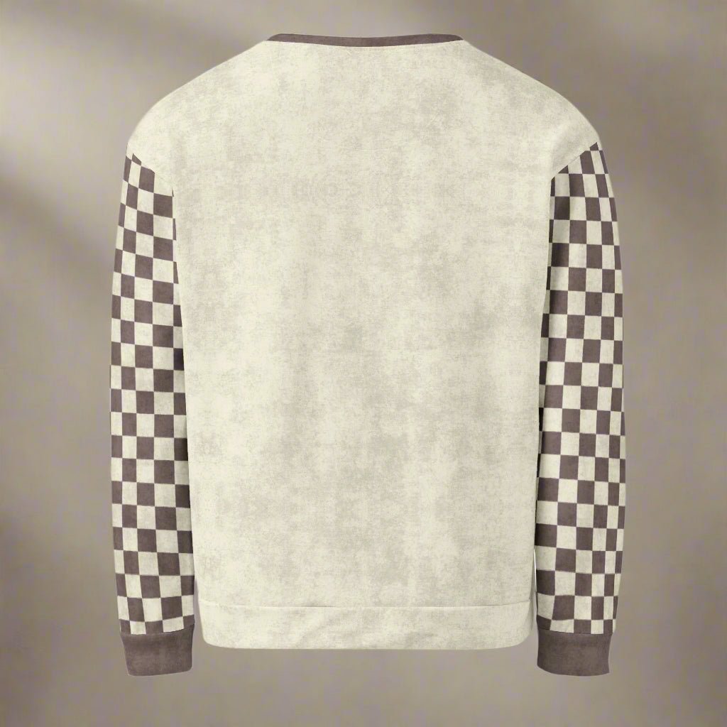 Beige sweater with checkered sleeves on a beige background