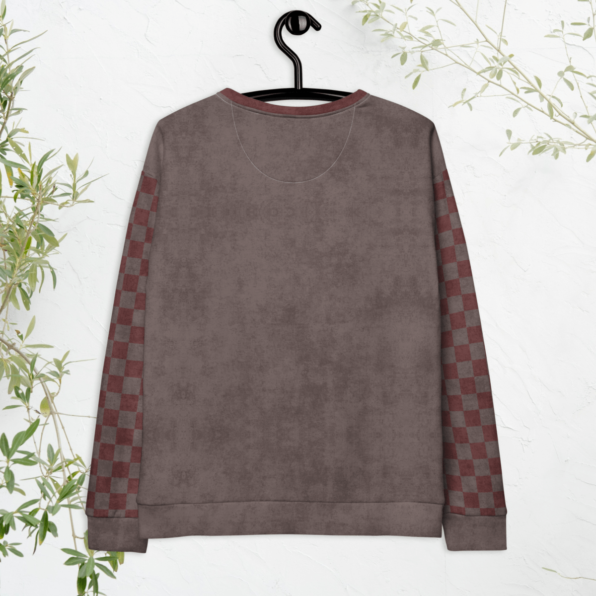 espresso and burgundy sweatshirt with checkered sleeves on a hanger against a white background