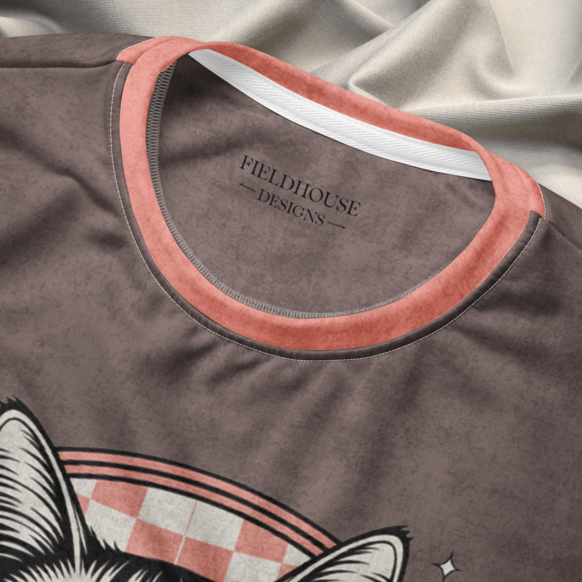 collar close up of an Espresso sweatshirt with a sunglasses-wearing tabby cat and “I Do What I Want” text; sleeves feature pink-and-espresso checkerboard pattern with pink collar and cuffs.