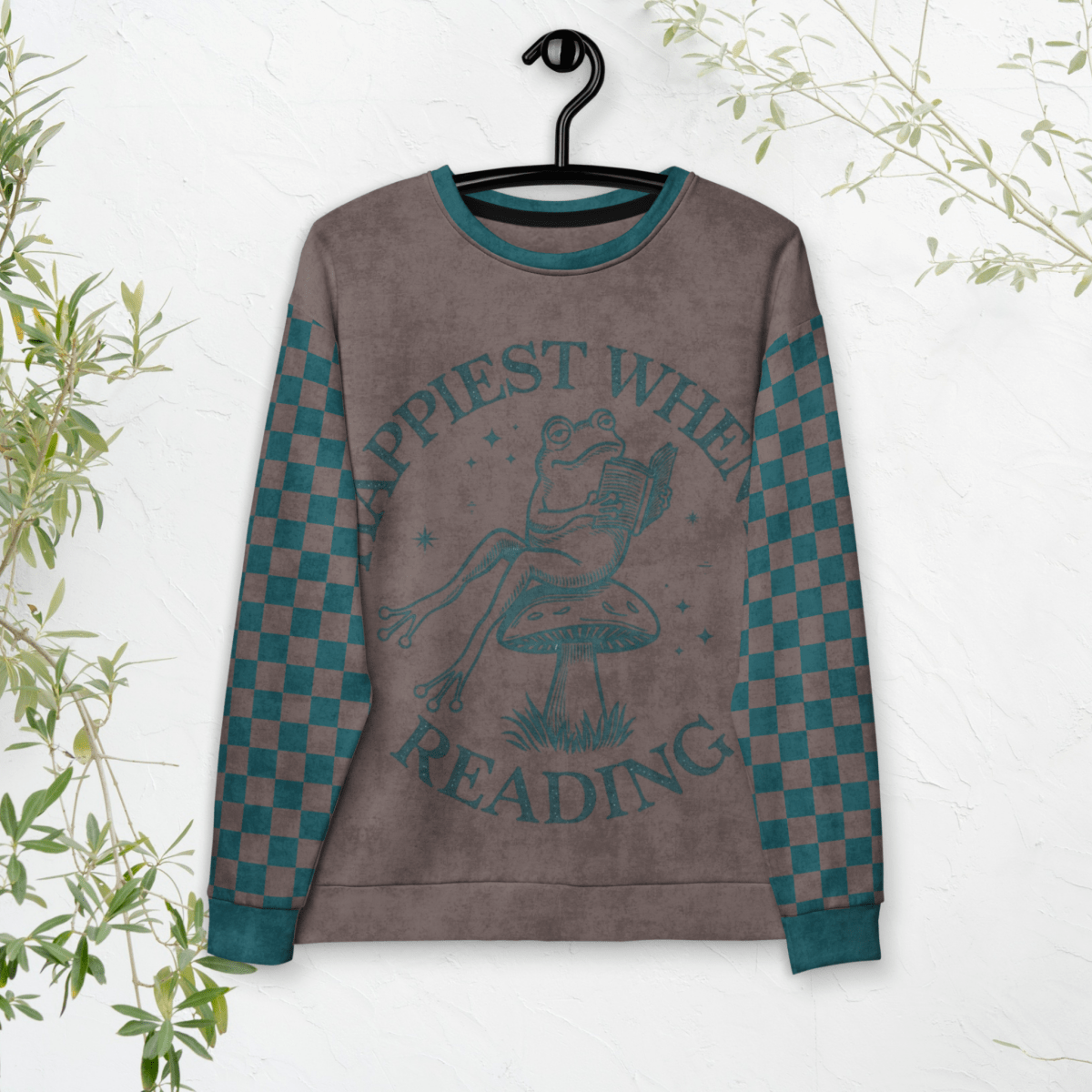 Sweatshirt with a Frog reading with "Happiest When I'm Reading" design on a white background