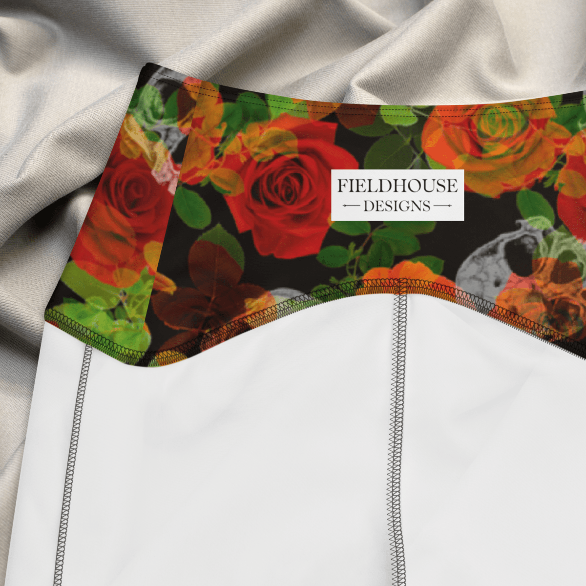 Colorful floral design on a waistband with 'Fieldhouse Designs' label.