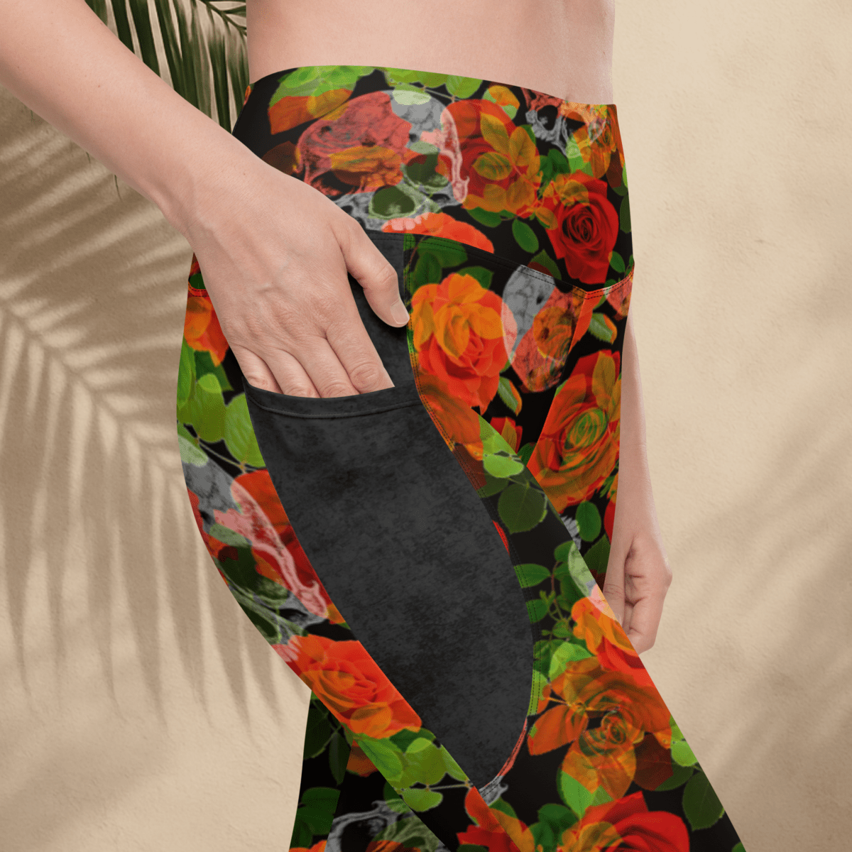 Colorful floral-patterned leggings with a pocket on a beige background