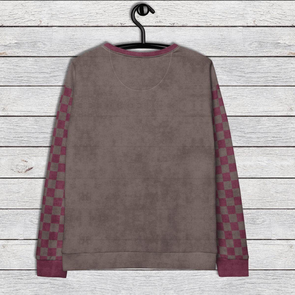 espresso sweatshirt with checkered sleeves on a wooden surface