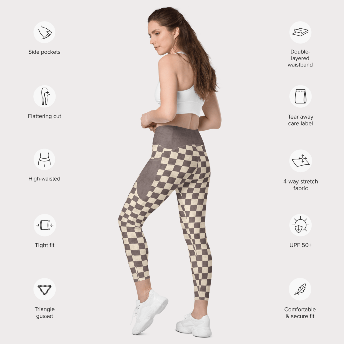 Woman wearing checkered leggings with feature icons on a white background