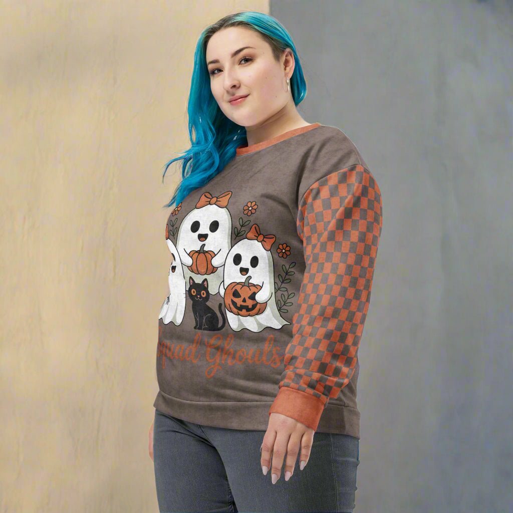 Person wearing a Halloween-themed sweatshirt with ghost and cat design on a neutral background