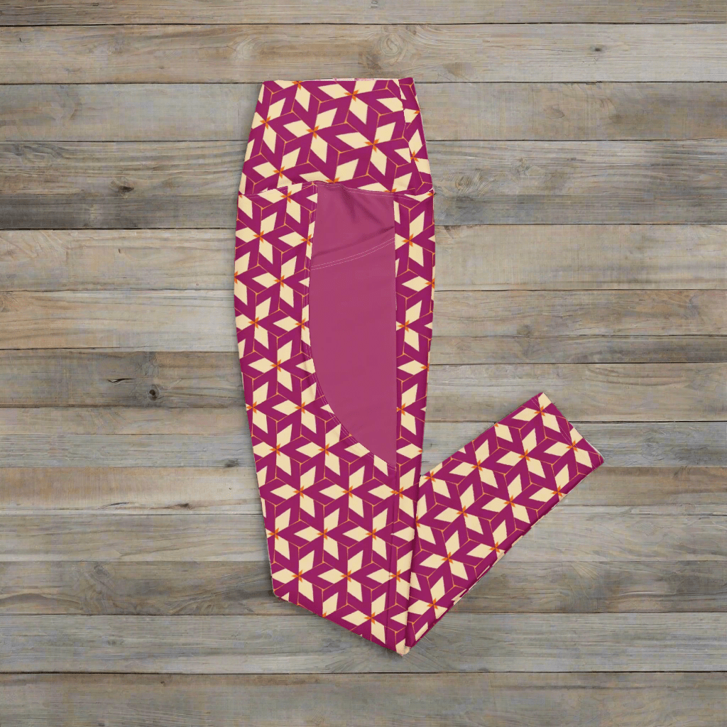 Purple leggings with cream geometric pattern on a wooden surface