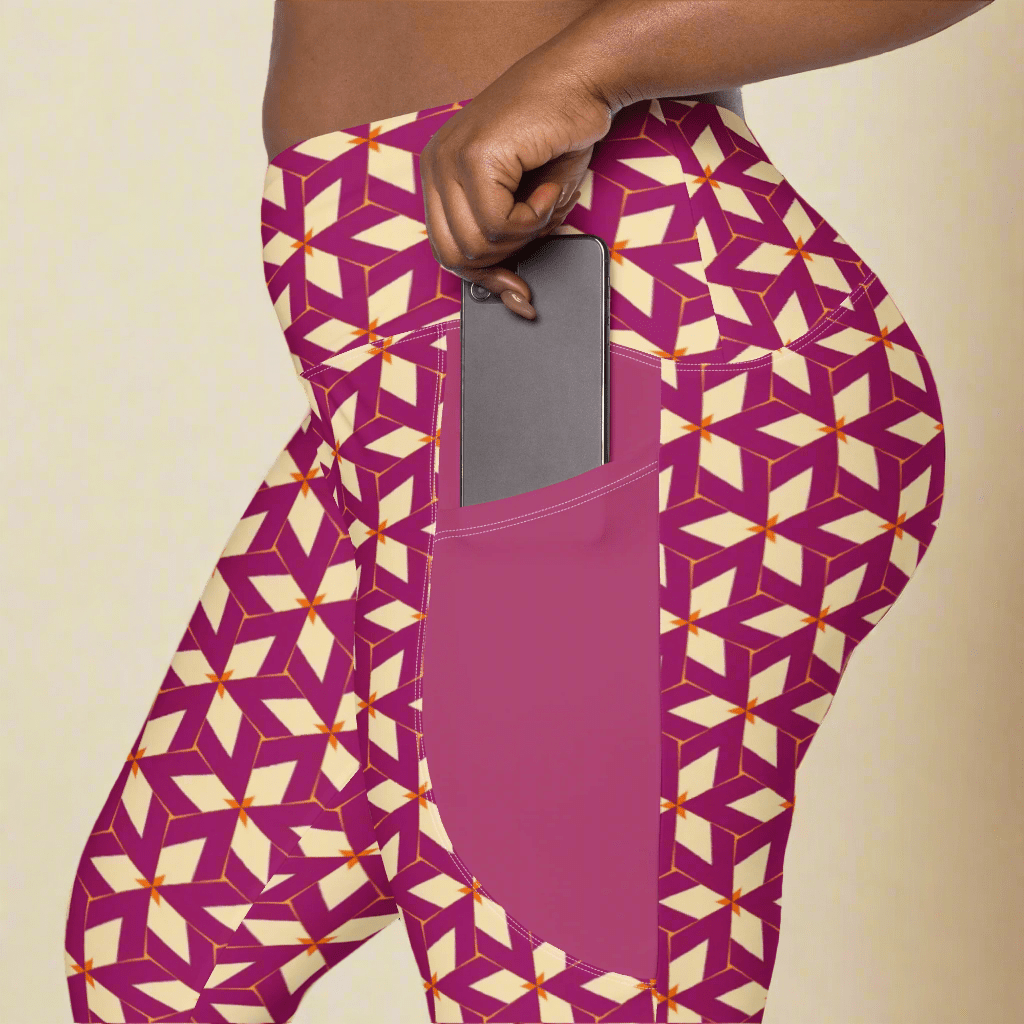 Purple leggings with geometric pattern worn by a person, showing a pocket.