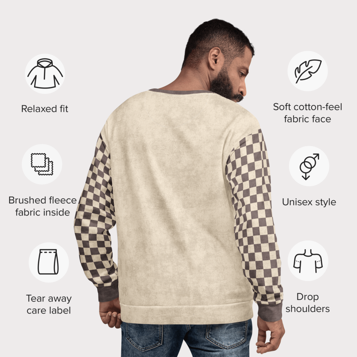 rear view and specs for Beige crewneck sweatshirt with espresso checkered sleeves. Featuring a raccoon reading a book graphic and text 'Not my trash, not my dumpster'