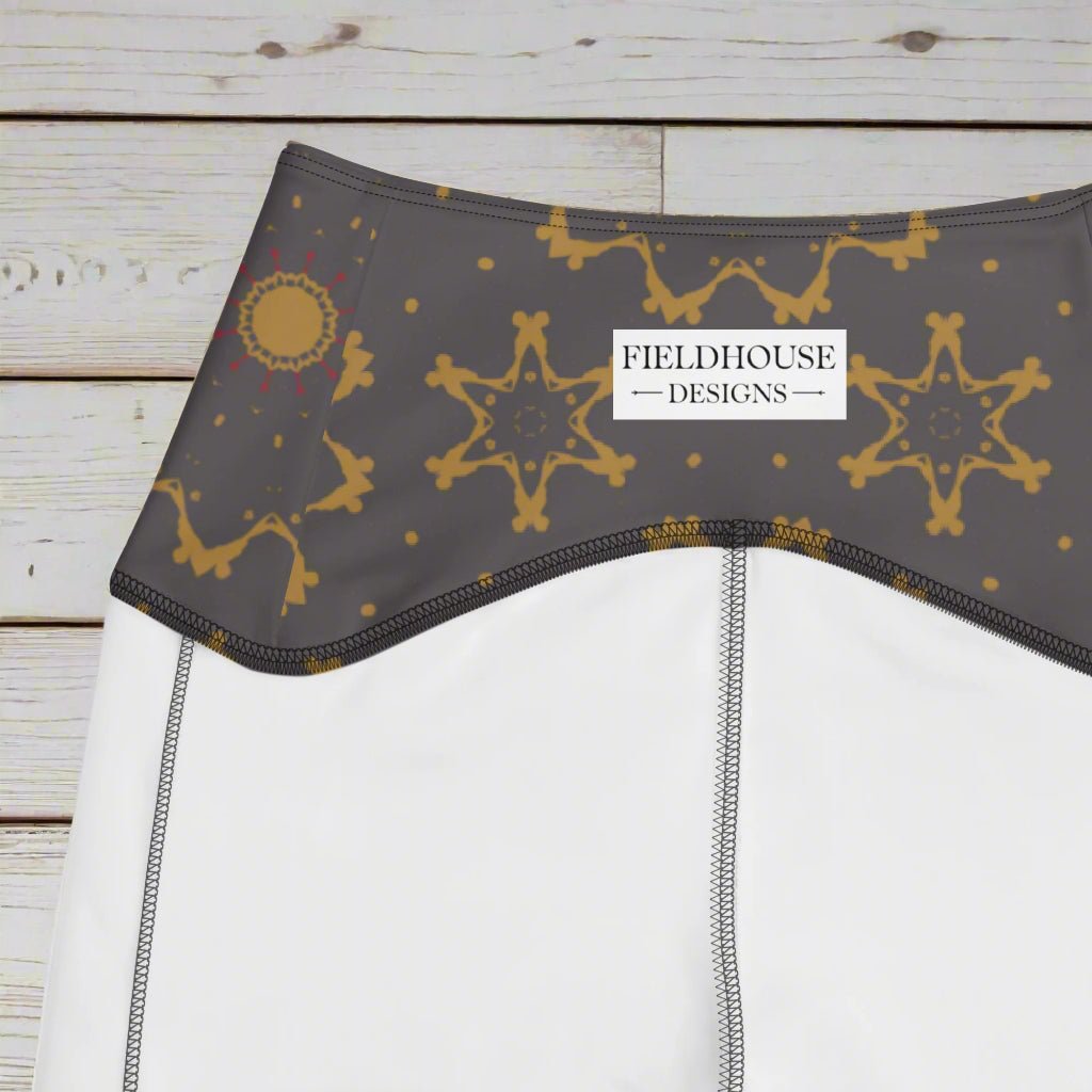 Gray bra with gold star patterns on a wooden surface, featuring 'Fieldhouse Designs' branding.