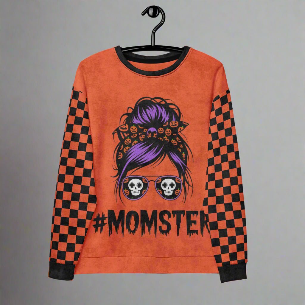 Orange sweatshirt with '#MOMSTER' design on a hanger