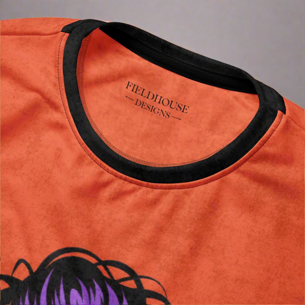 Orange t-shirt with black neckline and 'Fieldhouse Designs' label on a gray background