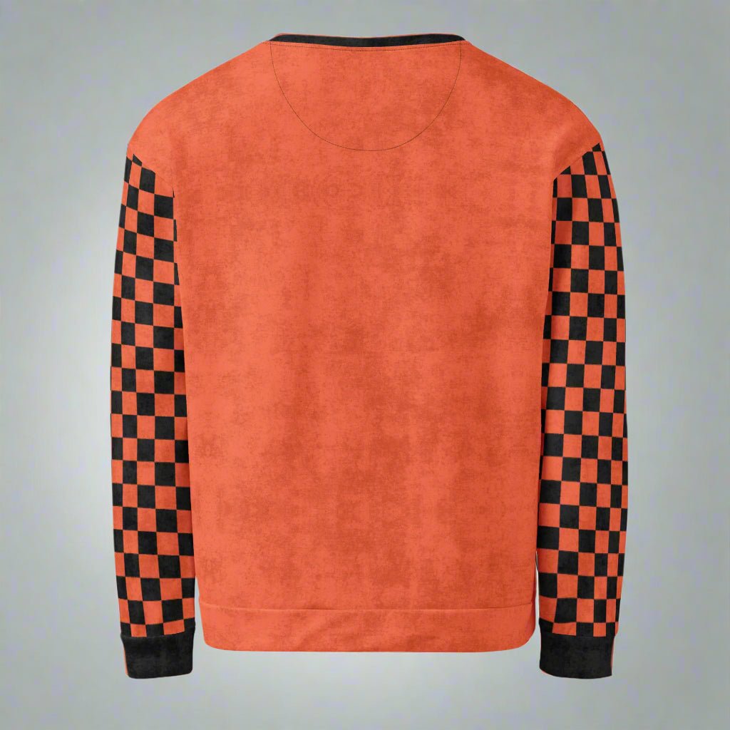 Orange sweatshirt with black and red checkered sleeves on a neutral background