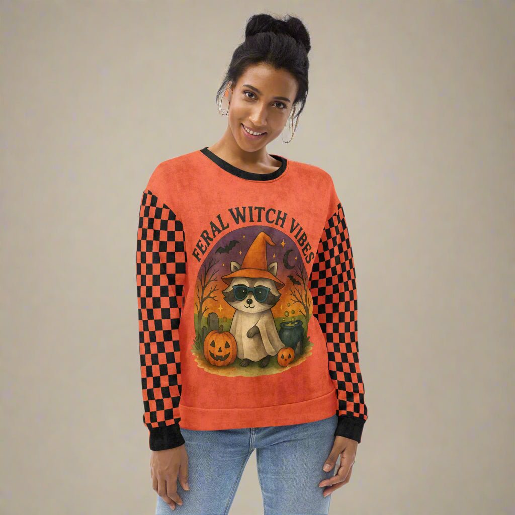 Person wearing a Halloween-themed sweatshirt with a raccoon design and text.