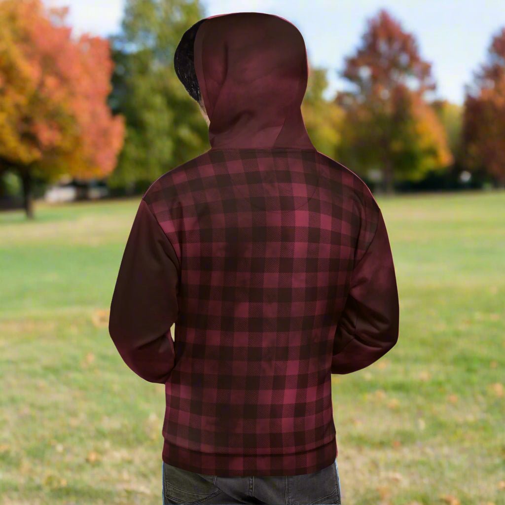 burgundy and black plaid hoodie worn by a person outdoors