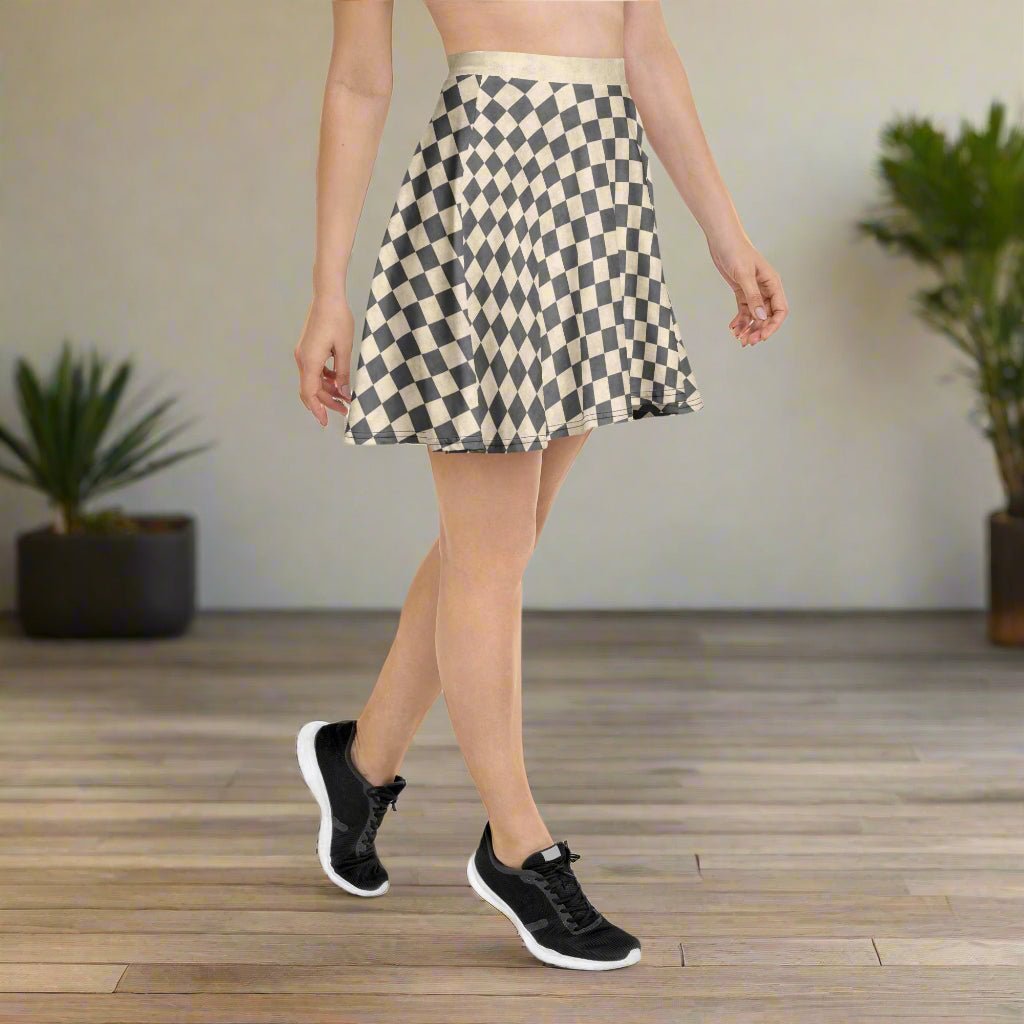 Person wearing a checkered skirt and black sneakers on a wooden floor.