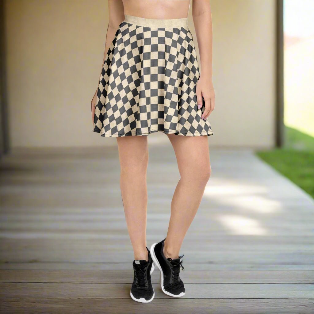 Person wearing a gray and ivory checkered skirt on a white background