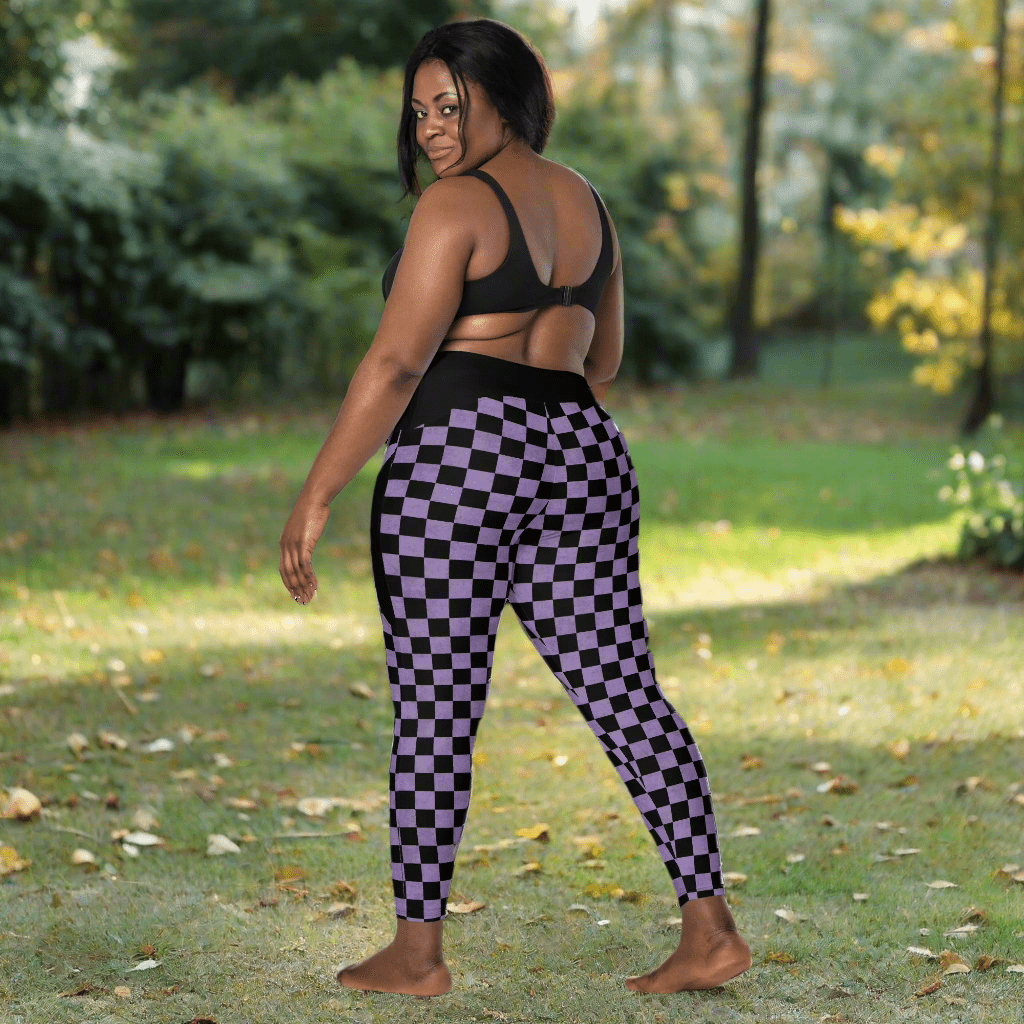Woman wearing black and purple checkered leggings outdoors