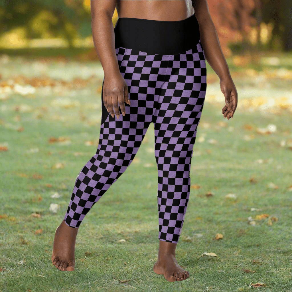 Person wearing black and purple checkered leggings outdoors