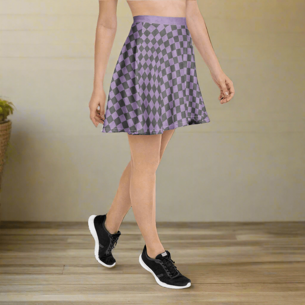 Person wearing a checkered skirt with a neutral background