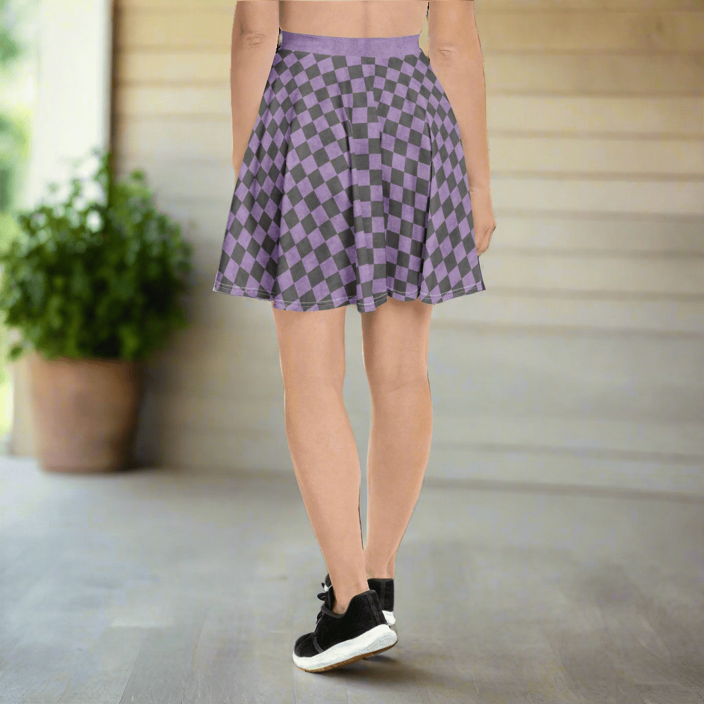 Person wearing a purple and gray checkered skirt on a porch