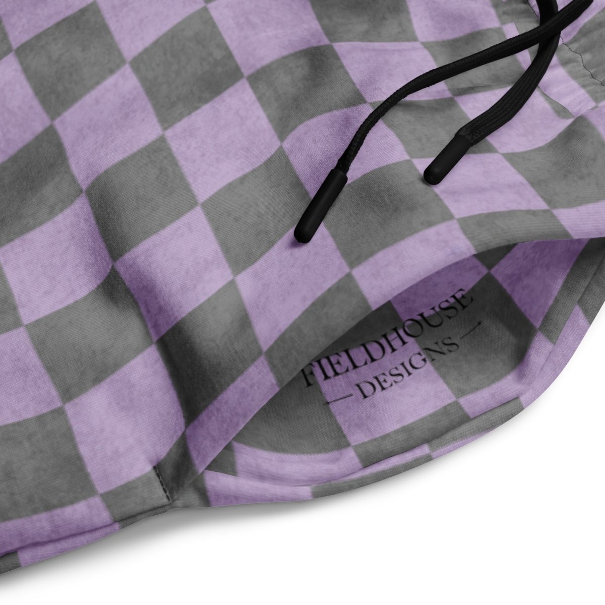 Purple and gray checkered pants with 'Fieldhouse Designs' branding.
