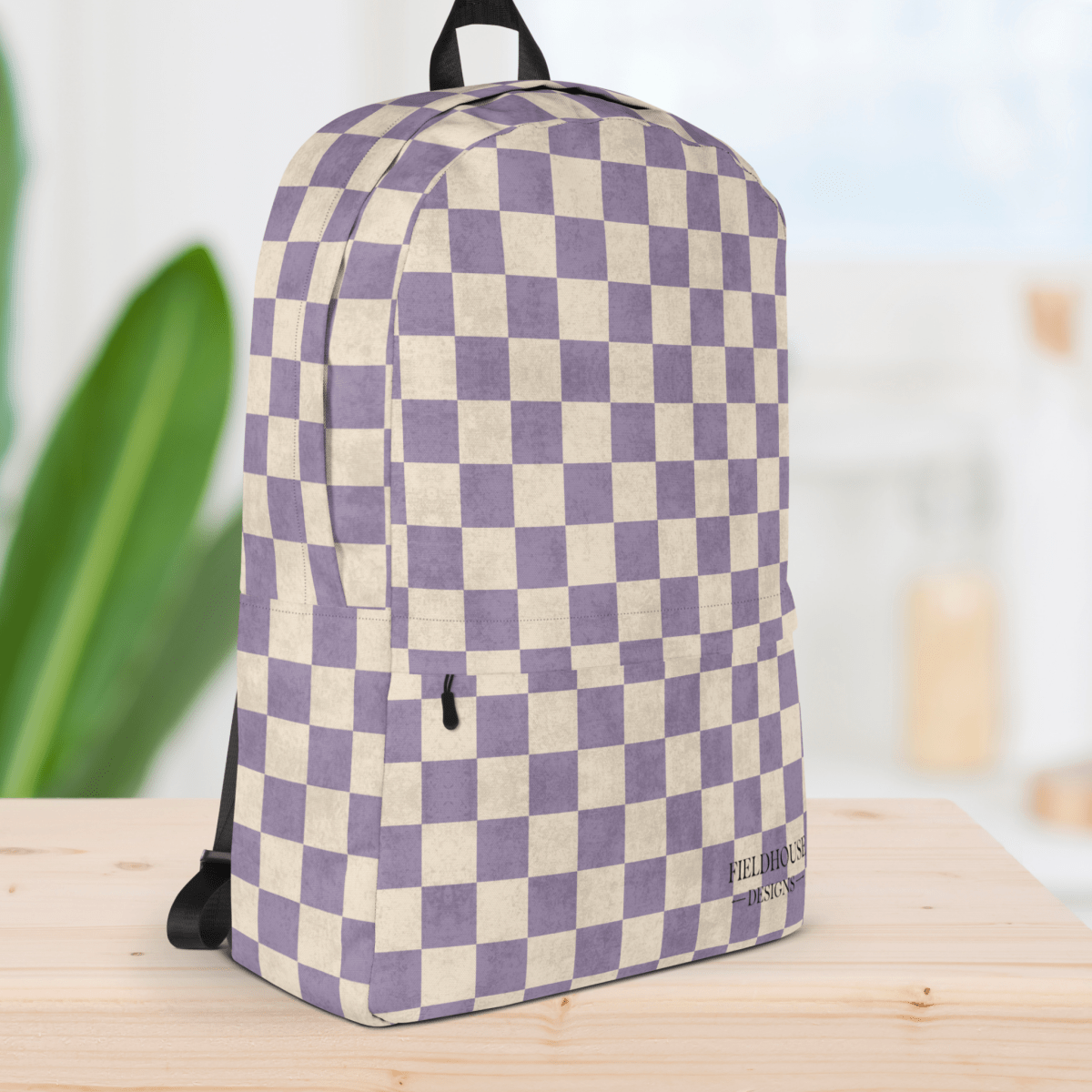 Checkered backpack with purple and white pattern on a wooden surface