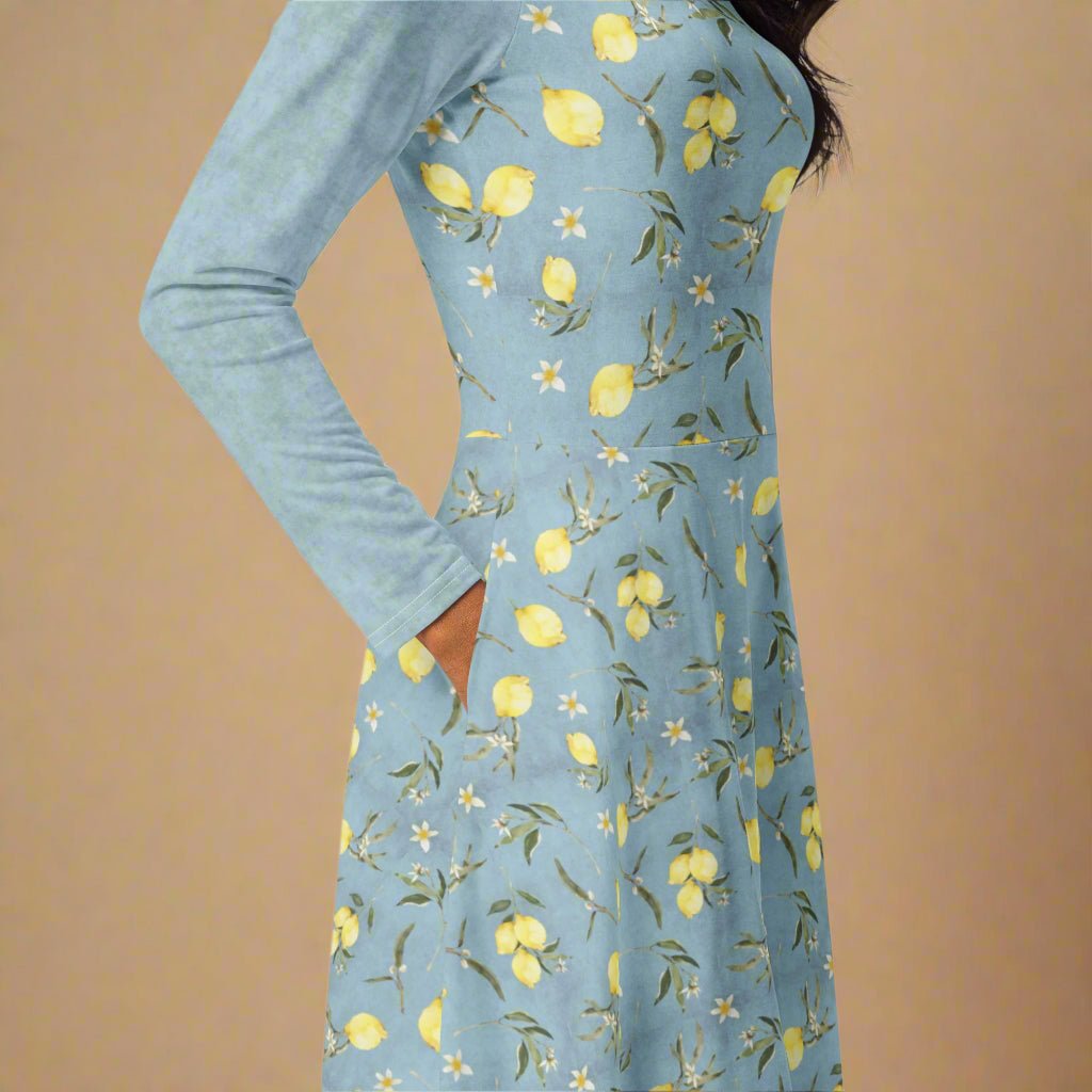 Blue dress with lemon pattern on a beige background