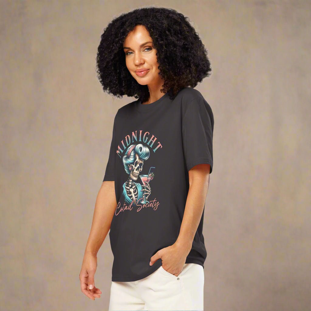 Woman wearing a dark gray t-shirt with a skeleton design on a white background