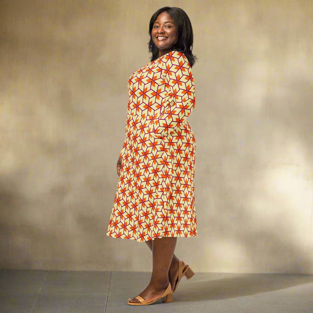 Woman wearing a patterned dress on a neutral background