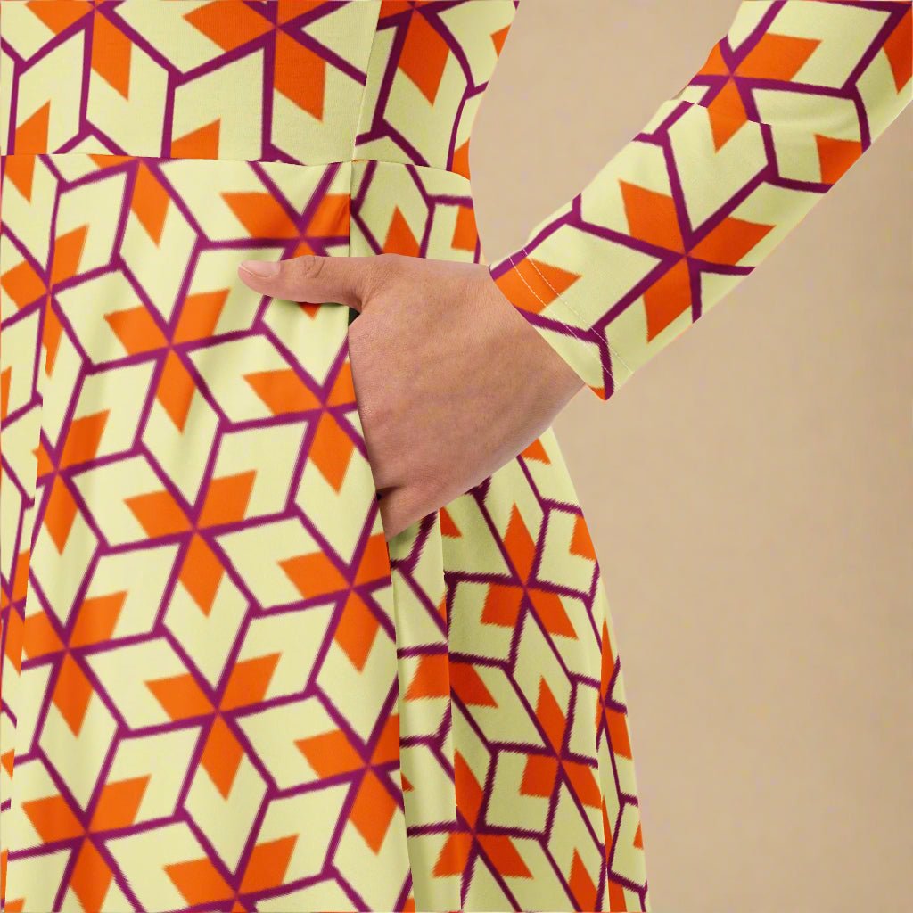 Close-up of a dress with geometric pattern , hand in pocket, beige background
