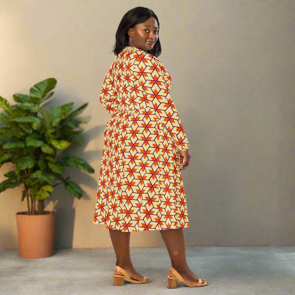 Woman wearing a geometric patterned dress on a neutral background