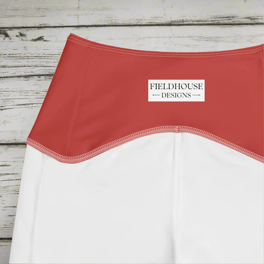 garment with 'Fieldhouse Designs' logo on a wood background