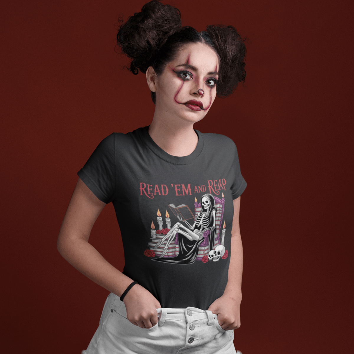 Person wearing a t-shirt with a graphic design on a red background