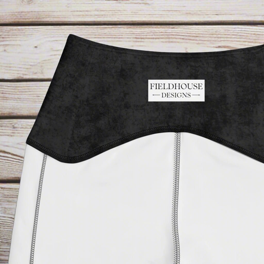 Close-up of a black waistband with 'Fieldhouse Designs' branding.